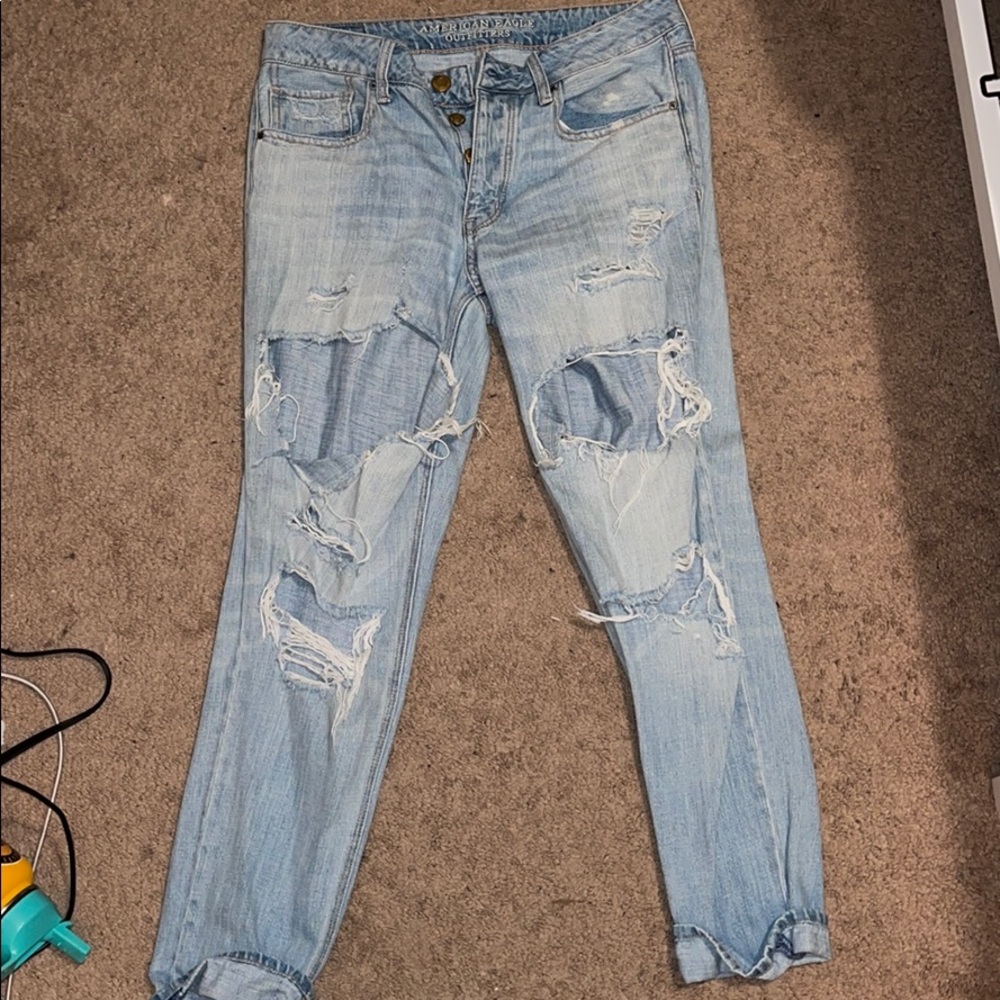 Ultra distressed, low rise American eagle jeans